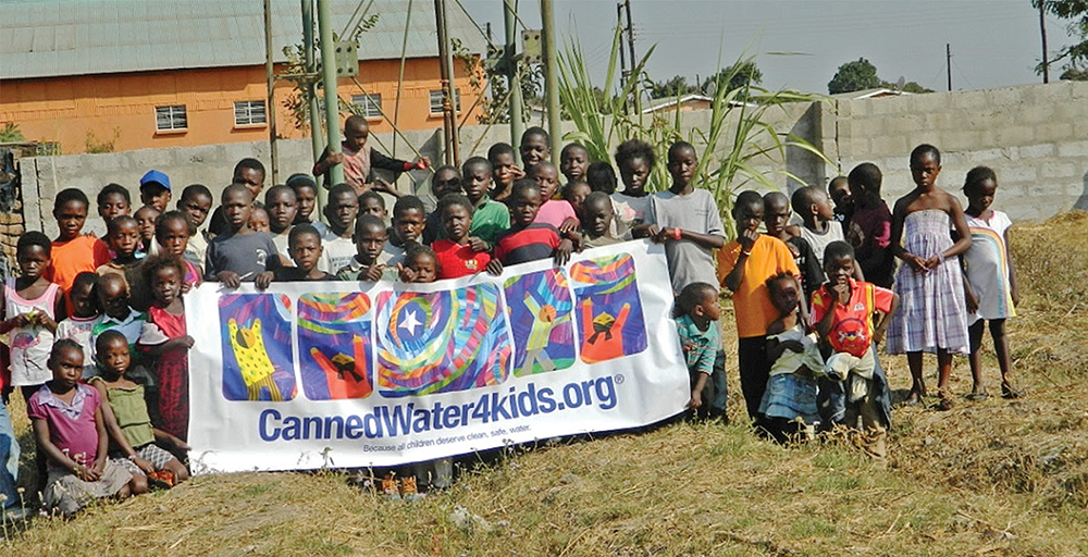 Henkel team donates prize money to CannedWater4kids to help save the children